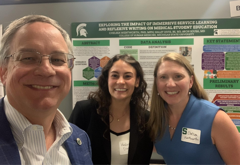 Aron, Haley Divis, MS3, and Chelsea Wentworth, PhD, MPH at the College of Human Medicine Medical Education Showcase